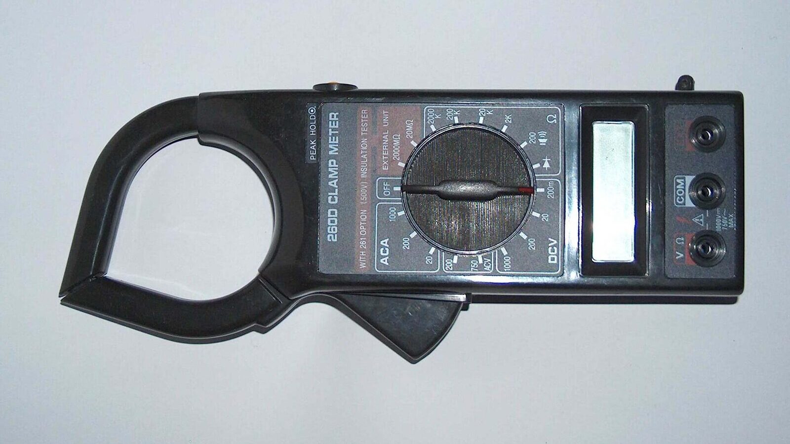 Clamp meter measuring current on an electrical cable