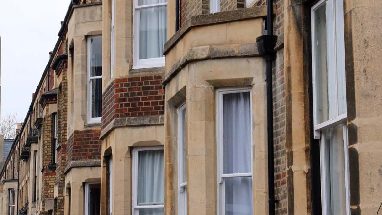 Row of British terraced houses on a residential street