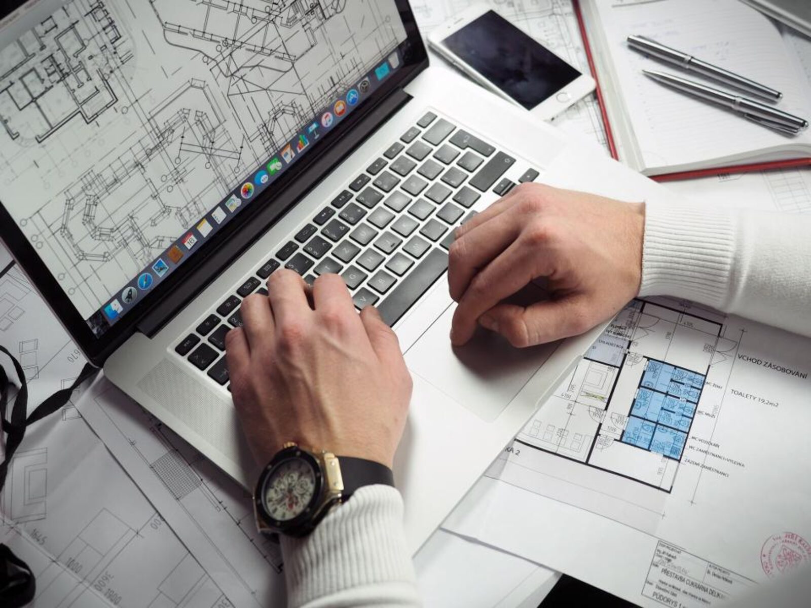Person comparing options on a laptop at a desk