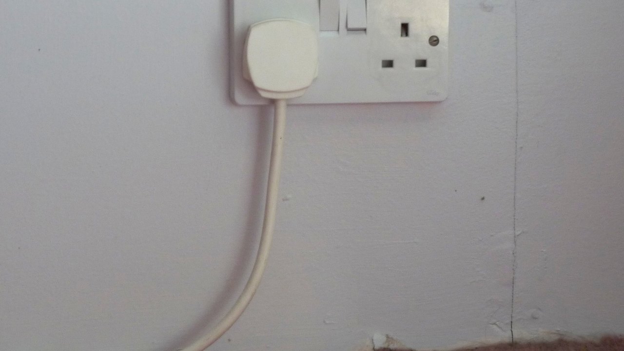 UK double wall socket with plugs fitted